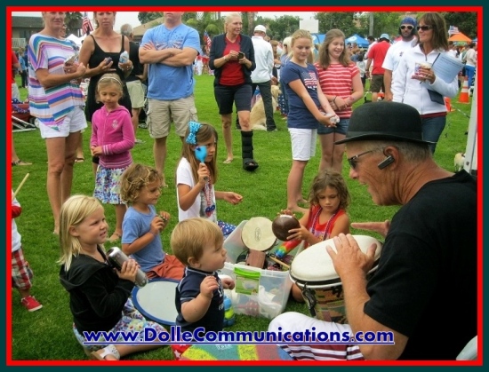 Young children captivated by their play in a drum circle
