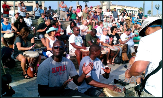 Drummers play and perform at this drum circle every Sunday at Pier Plaza in Huntington Beach, CA